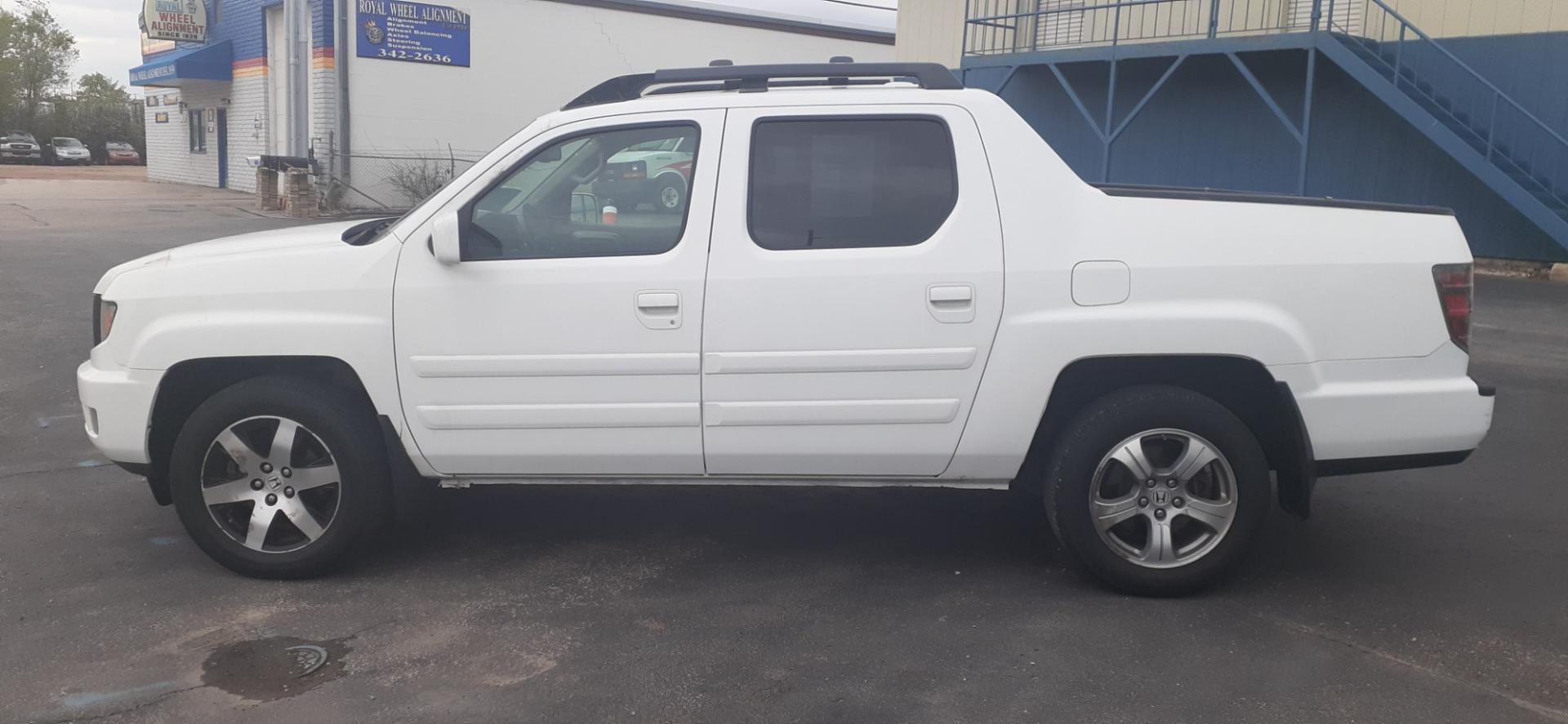 2014 Honda Ridgeline RTL-S (5FPYK1F67EB) with an 3.5L V6 SOHC 24V engine, 5-Speed Automatic transmission, located at 2015 Cambell Street, Rapid City, SD, 57701, (605) 342-8326, 44.066433, -103.191772 - Photo#0